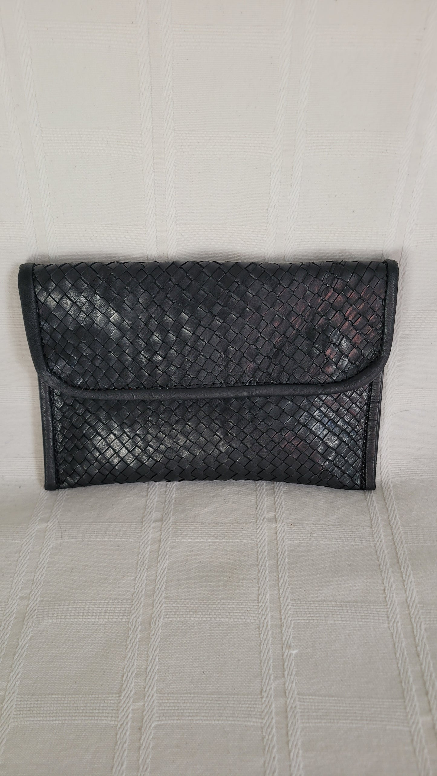 POCHETTE EN CUIR TRESSE