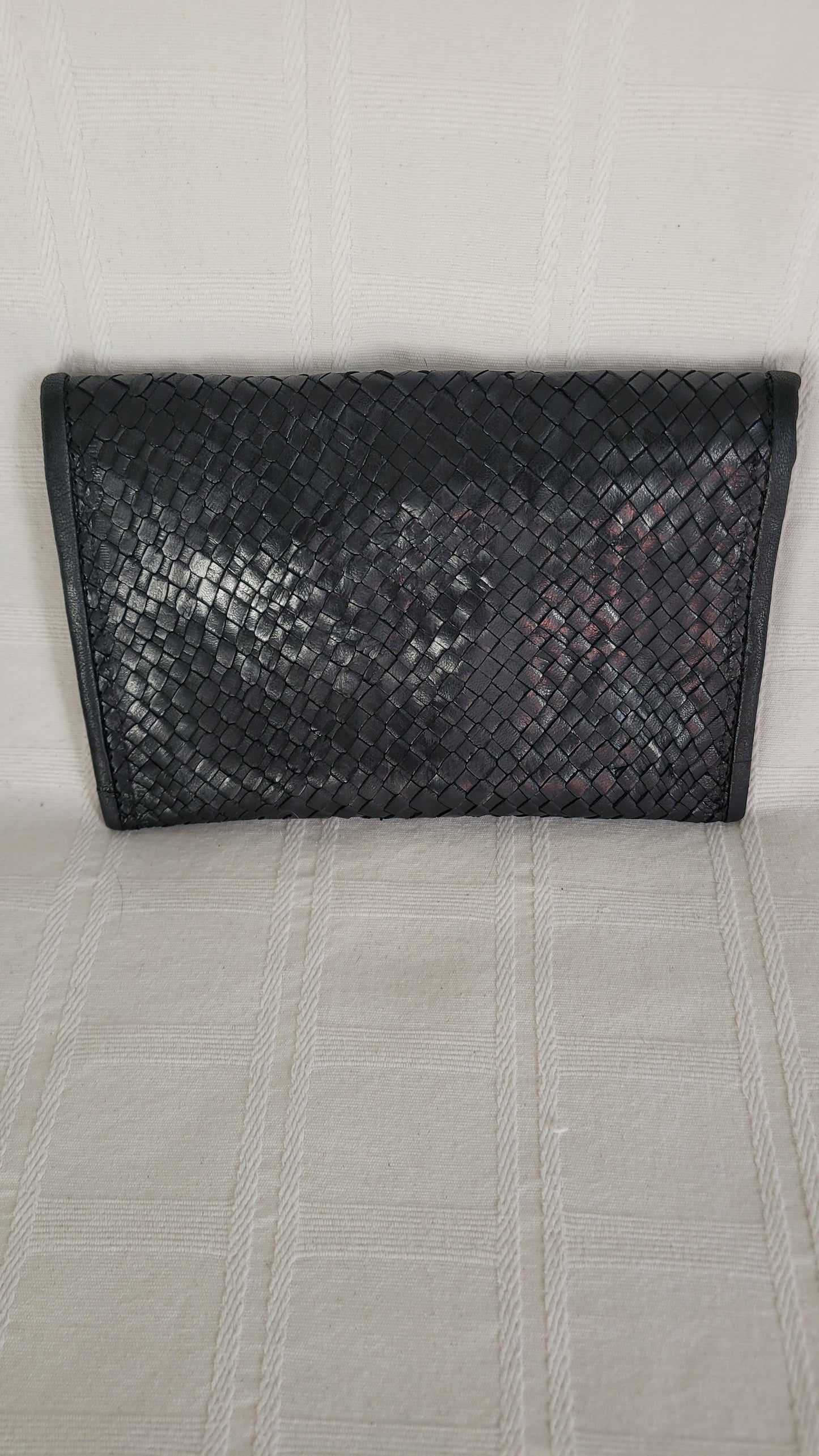 POCHETTE EN CUIR TRESSE